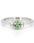oval shape demantoid garnet diamond bridal engagement ring custom made in montreal by bena jewelry on white background