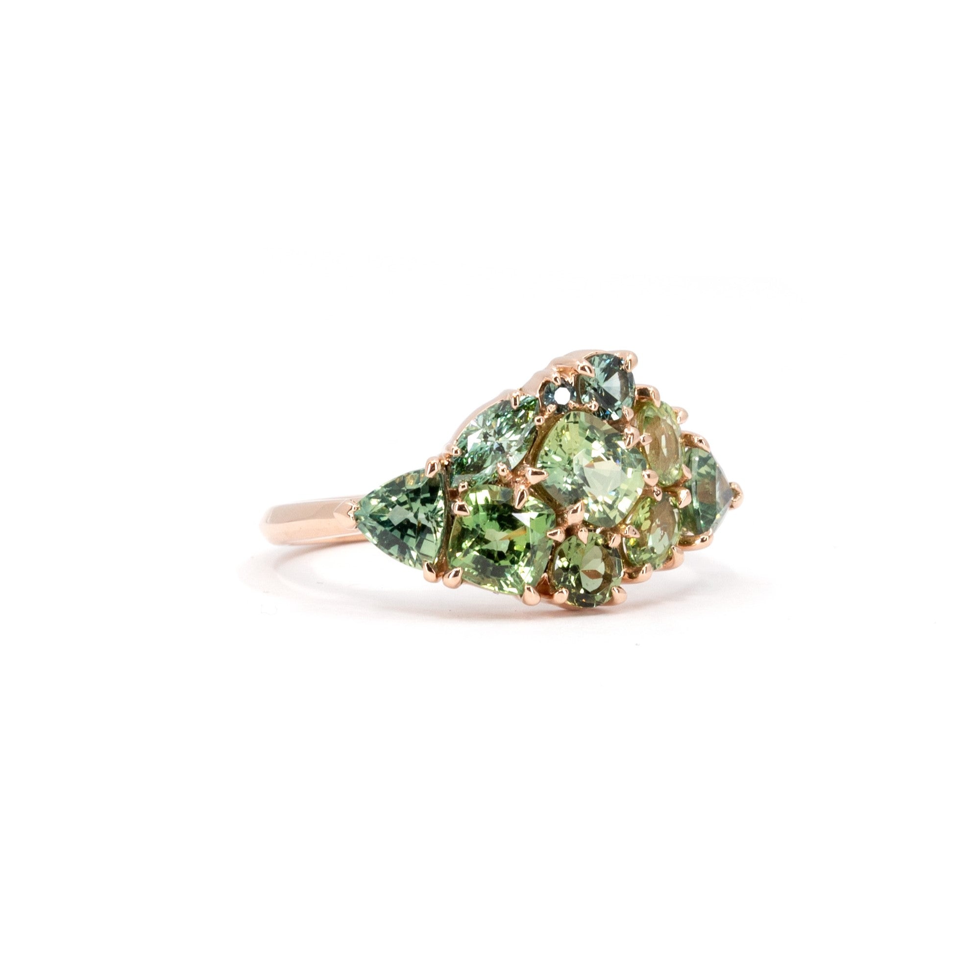 Displays the creative arrangement of the gemstones and their harmonious blend with the rose gold band. Made by Bena Jewelry, Montreal, Canada.