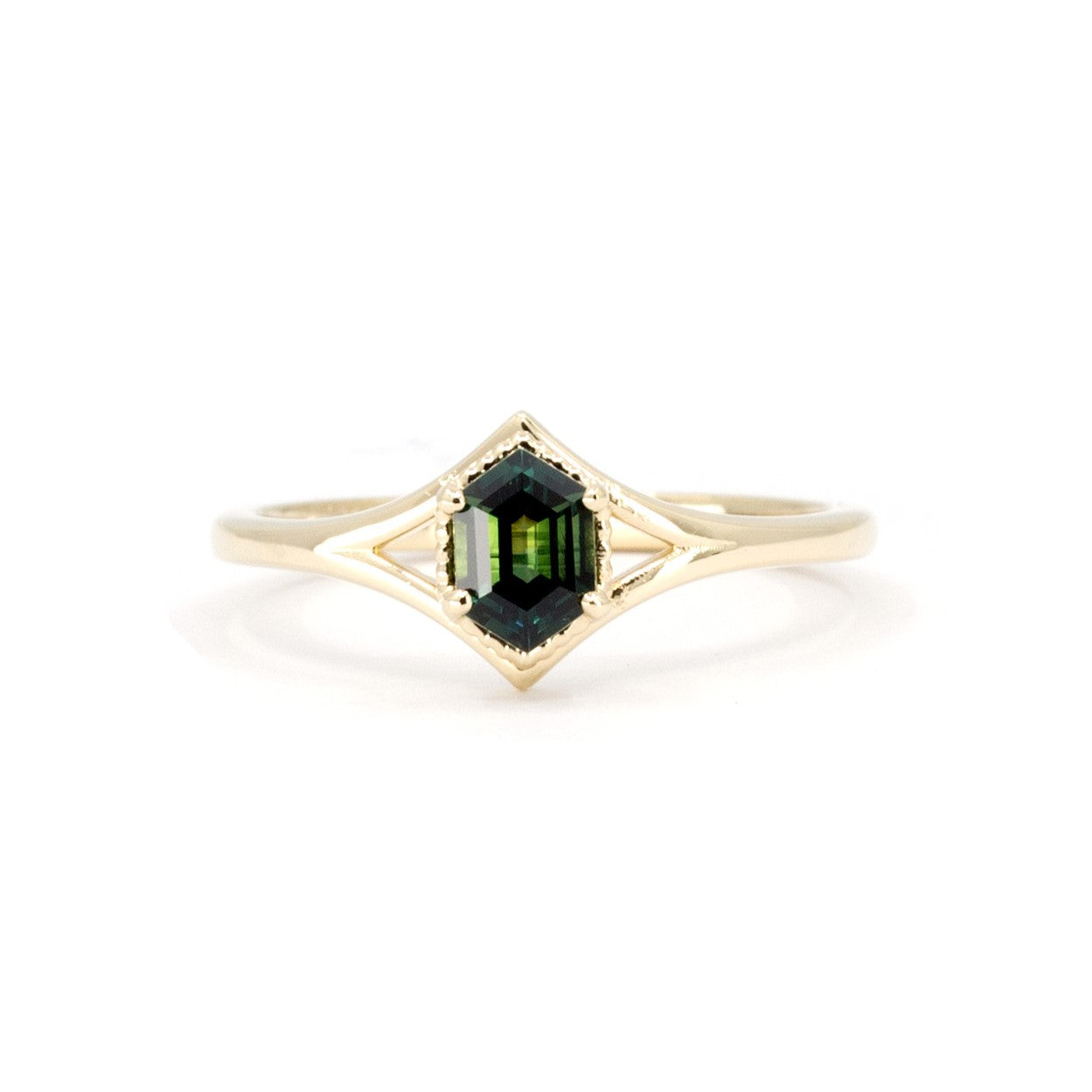 Front view of the Adorn Hexagonal Green Sapphire Ring by Bena Jewelry, showcasing the teal hexagonal sapphire and double band in yellow gold. Made in Montreal, Canada, this bespoke piece highlights elegant craftsmanship.