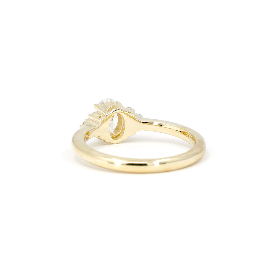 back view of yellow gold designer made in montreal bridal engagement ring desir on white background