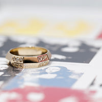 front view of edgy men wedding ring custom made in montreal by bena jewelry on multi color background