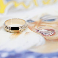 designer men wedding band yellow gold brown diamond ring on multi color background