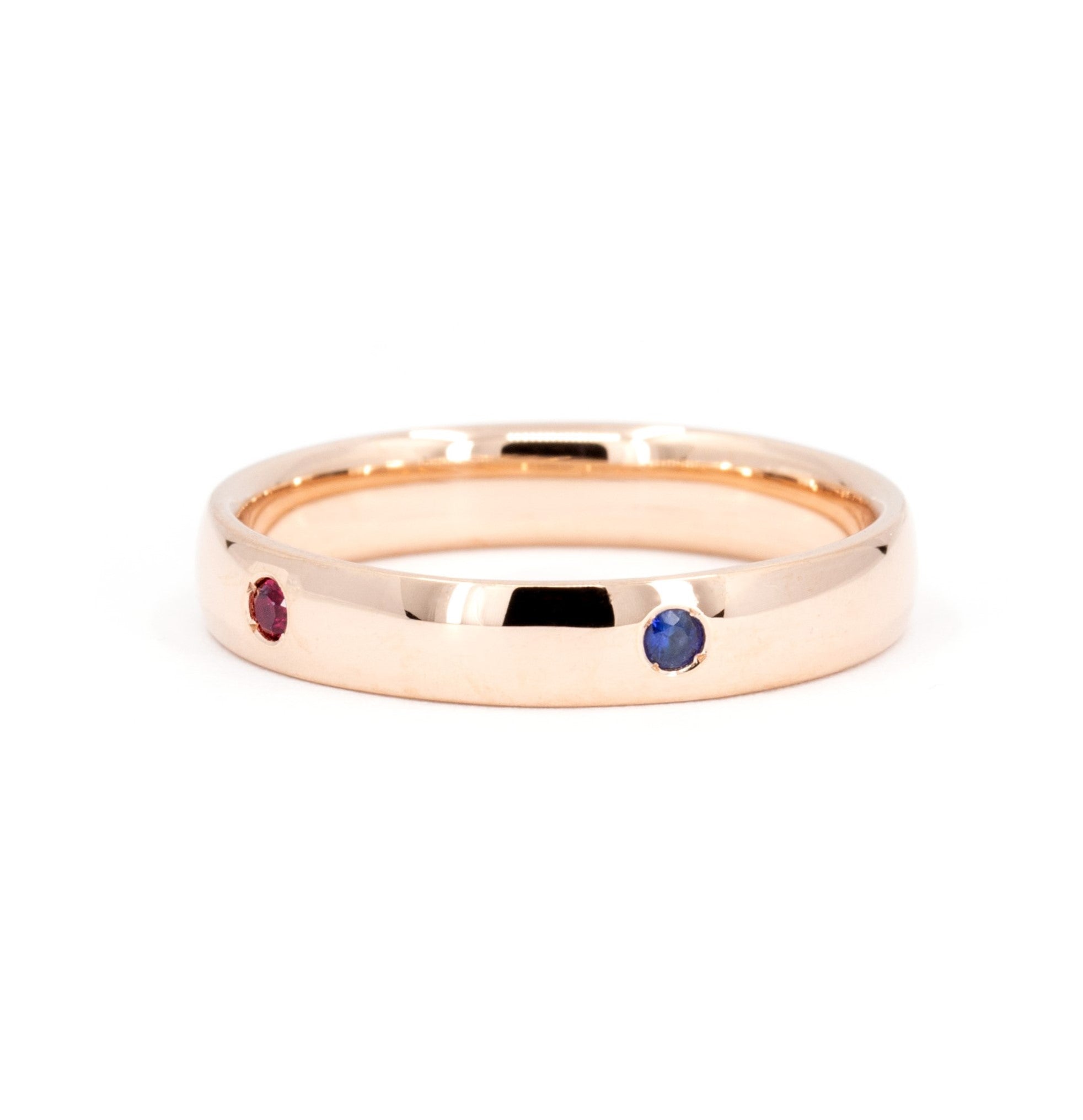 Multi Colored Gemstone Band in rose gold featuring vibrant gemstones in bezel settings by Bena Jewelry photographed on a clean white background custom-made in Montreal