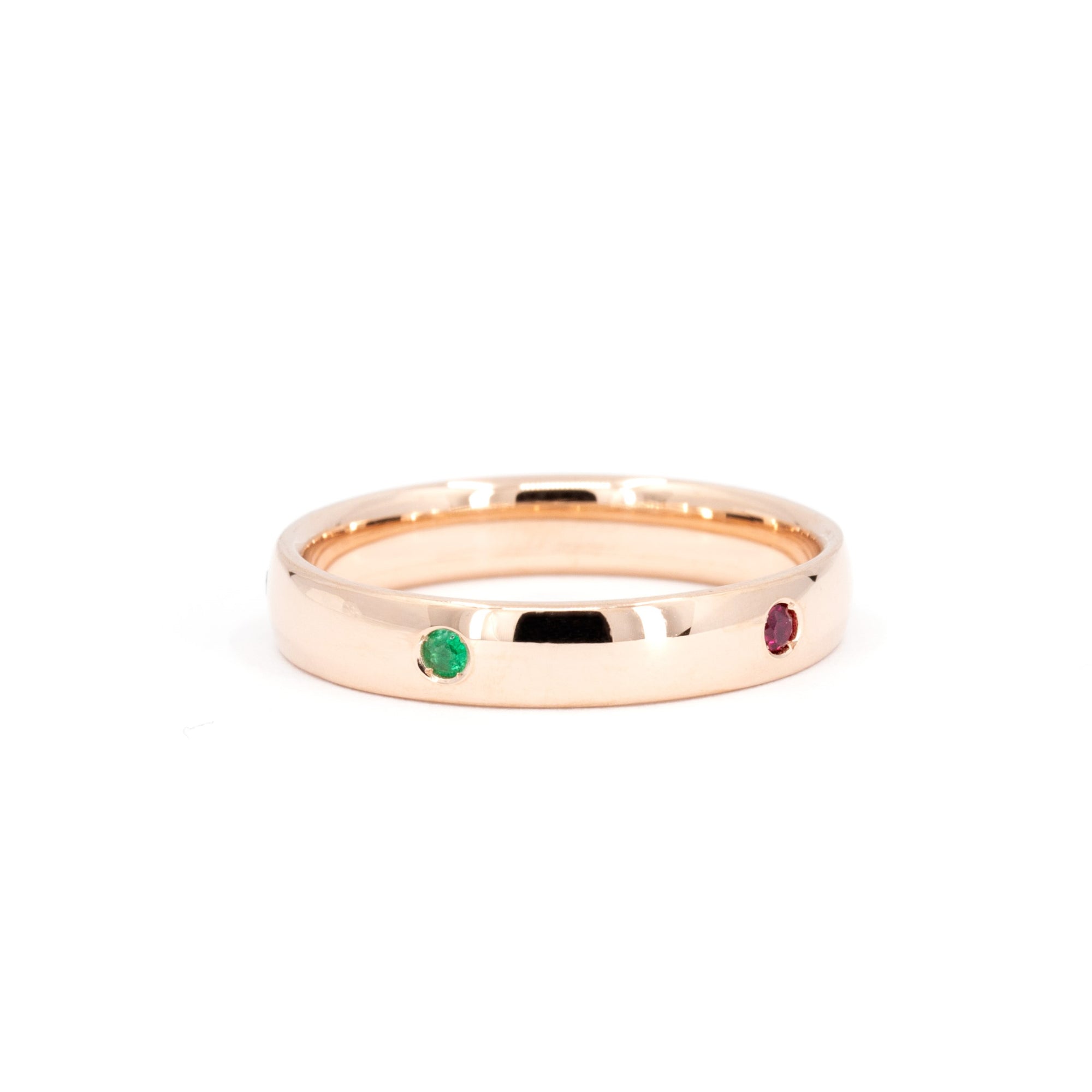 Rose gold men&#39;s ring with colorful gemstones Multi Colored Gemstone Band by Bena Jewelry displayed on a plain white background fine custom jewelry made in Canada