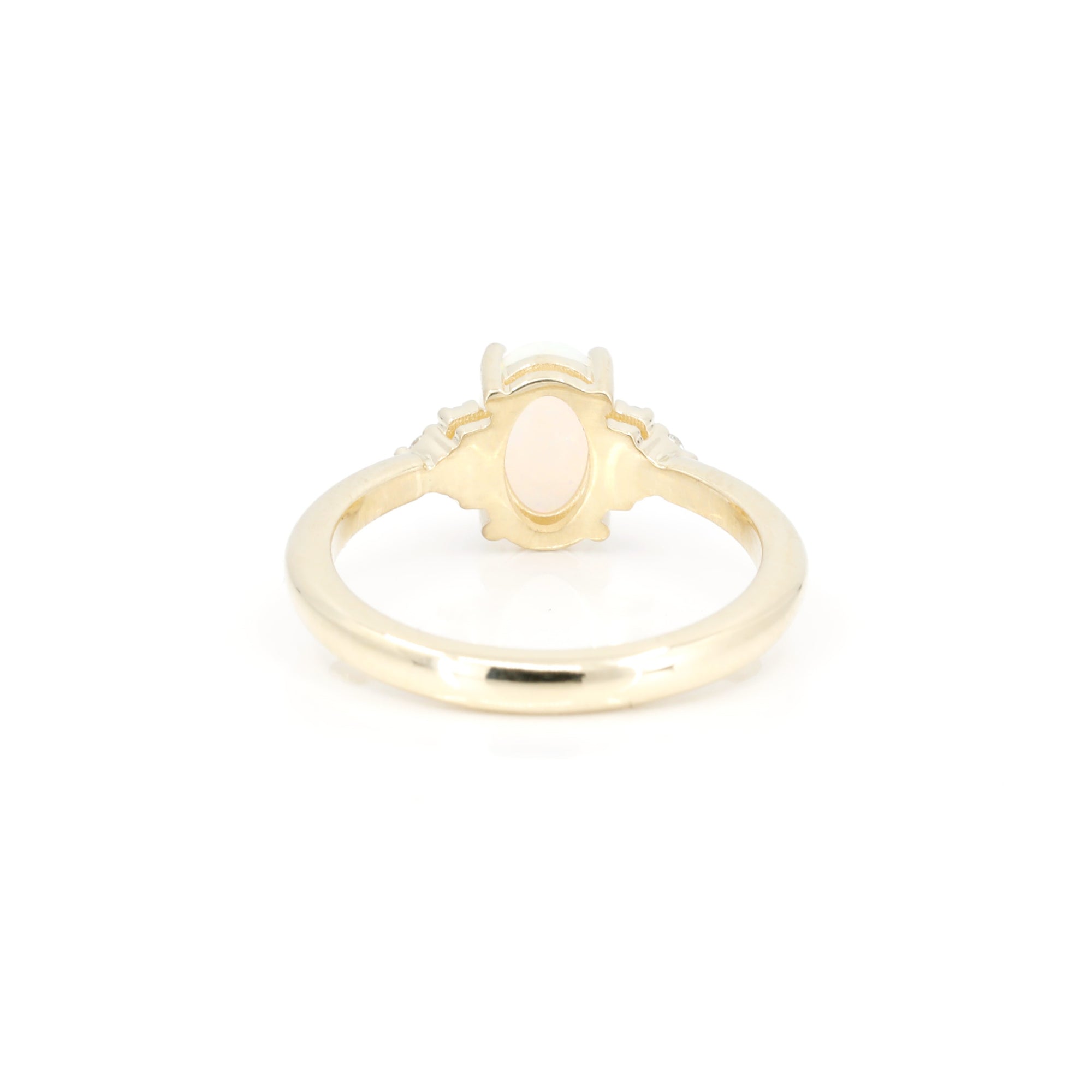 back view of yellow gold custom made engagement ring montreal bena jewelry on white background
