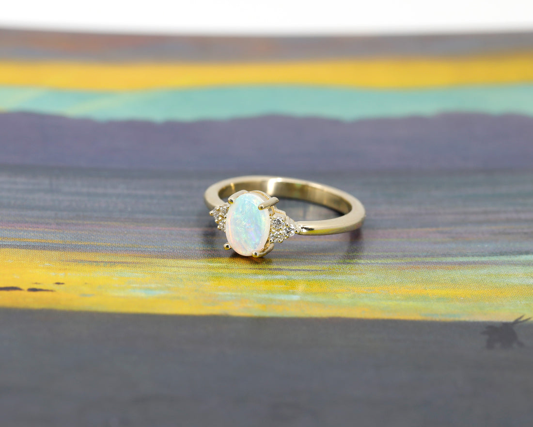 opal and diamond bridal engagement by bena jewelry designer ring custom made in montreal in yellow gold on multi color backgroud