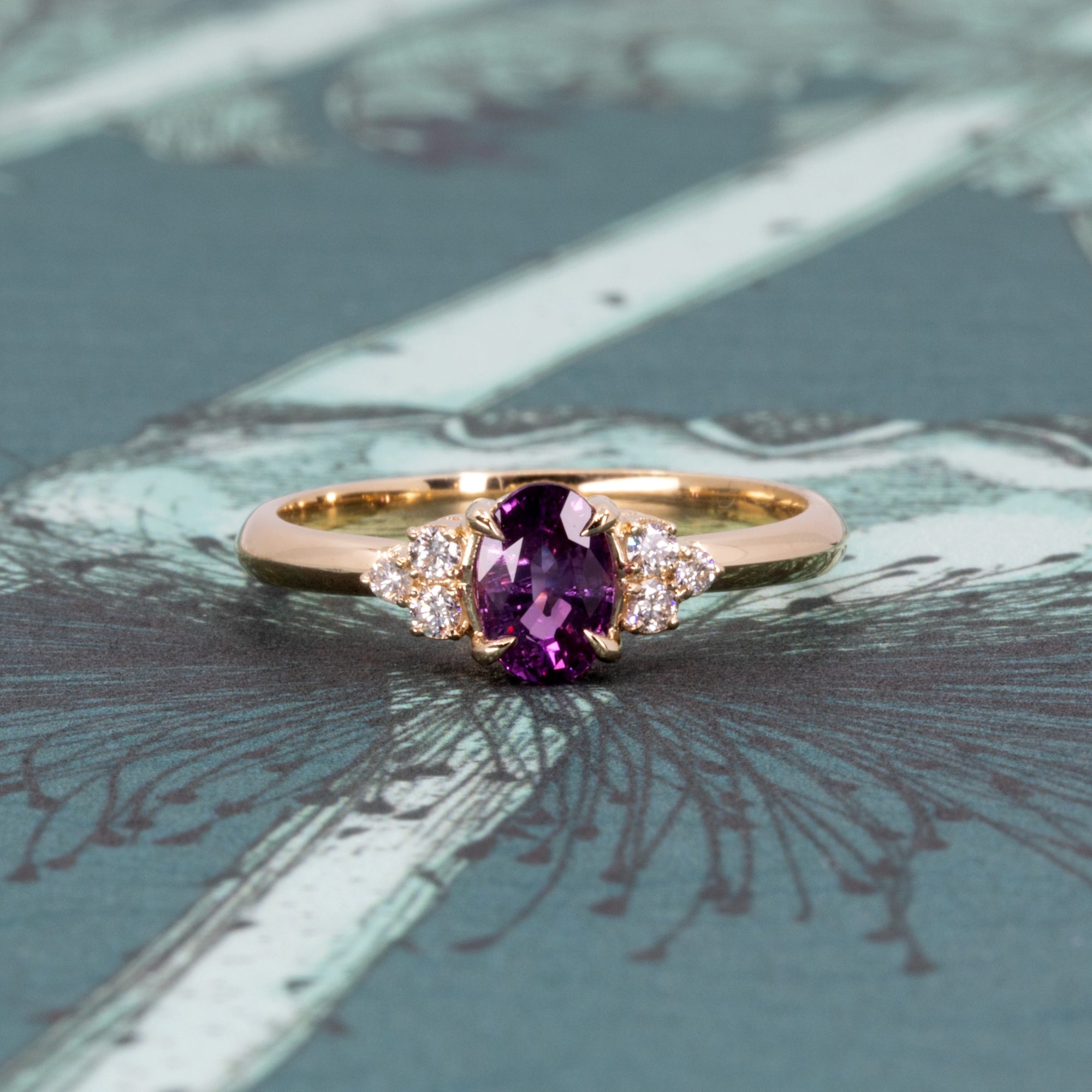 Detailed view of the Desir Ring, highlighting the sparkle of its purple-pink sapphire and diamonds, a fine jewelry piece from Bena Jewelry, Montreal.