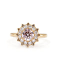 Light pink diamond sunburst ring with brown diamond halo and second halo of white diamonds