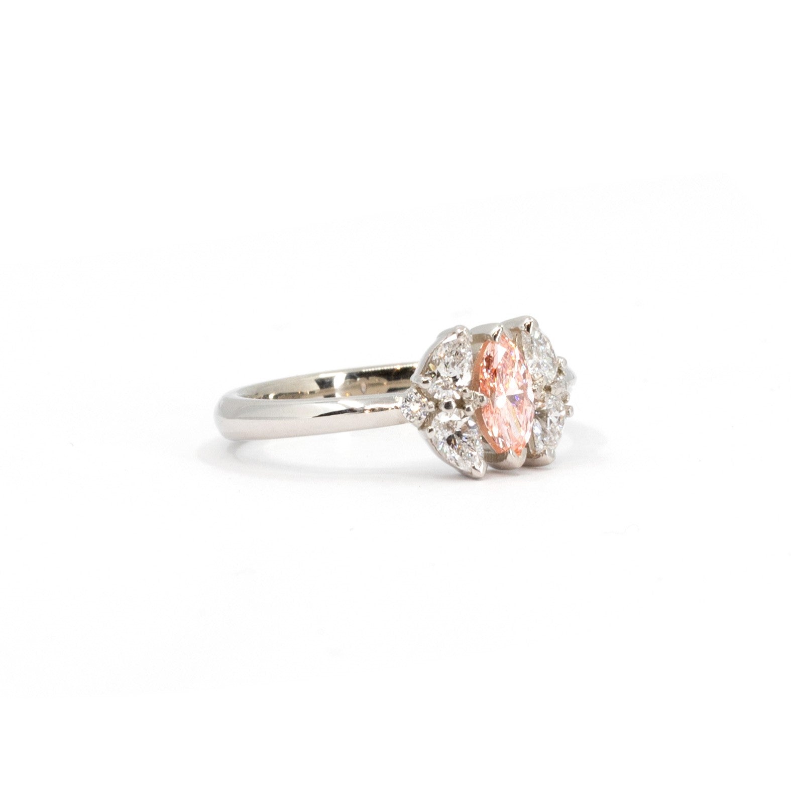 Bena Jewelry’s handcrafted engagement ring, featuring a pink marquise diamond and pear-cut diamonds – A one-of-a-kind fine jewelry piece, made in Montreal, blending classic elegance with contemporary craftsmanship.