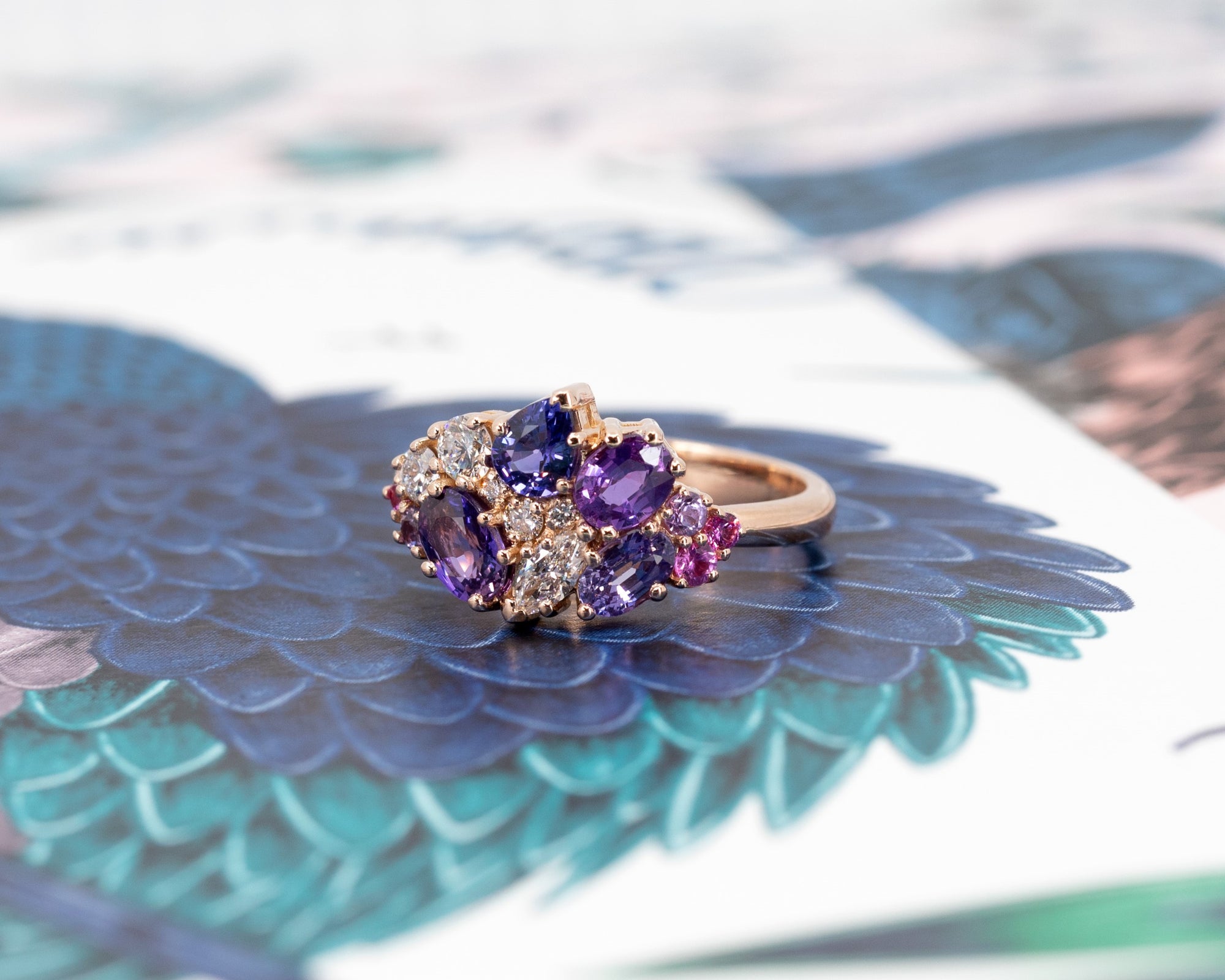Side view: Highlights the depth and brilliance of the sapphires and diamonds, set in a sleek yellow gold band. Custom-made by Bena Jewelry, Montreal, Canada.