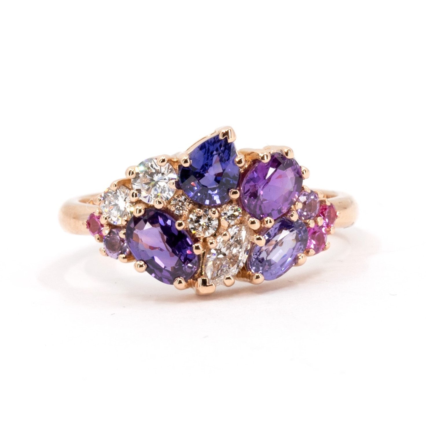 Front view: The Avalanche Purple Pink Sapphire Ring showcasing its artistic arrangement of purple and pink sapphires with diamonds in a polished yellow gold setting. Designed by Bena Jewelry in Montreal, Canada.