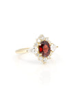 side view of pyrope garnet oval shape and lab grown diamond engagement ring custom made in montreal by bena jewelry on white background