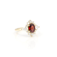 side view of pyrope garnet oval shape and lab grown diamond engagement ring custom made in montreal by bena jewelry on white background