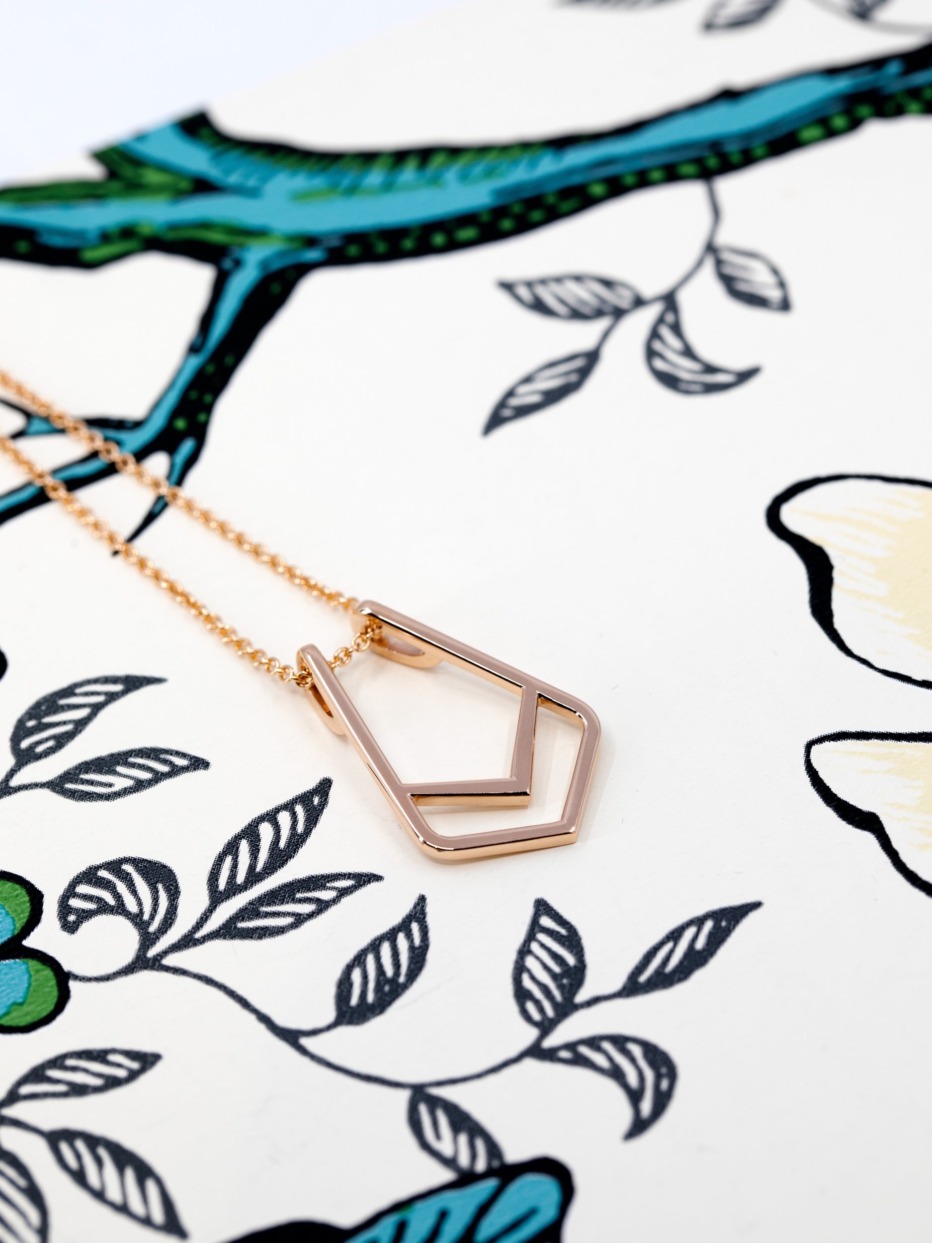Close-up of Ring Holder Pendant in Rose Gold – A sleek fine jewelry piece with a functional and stylish design.