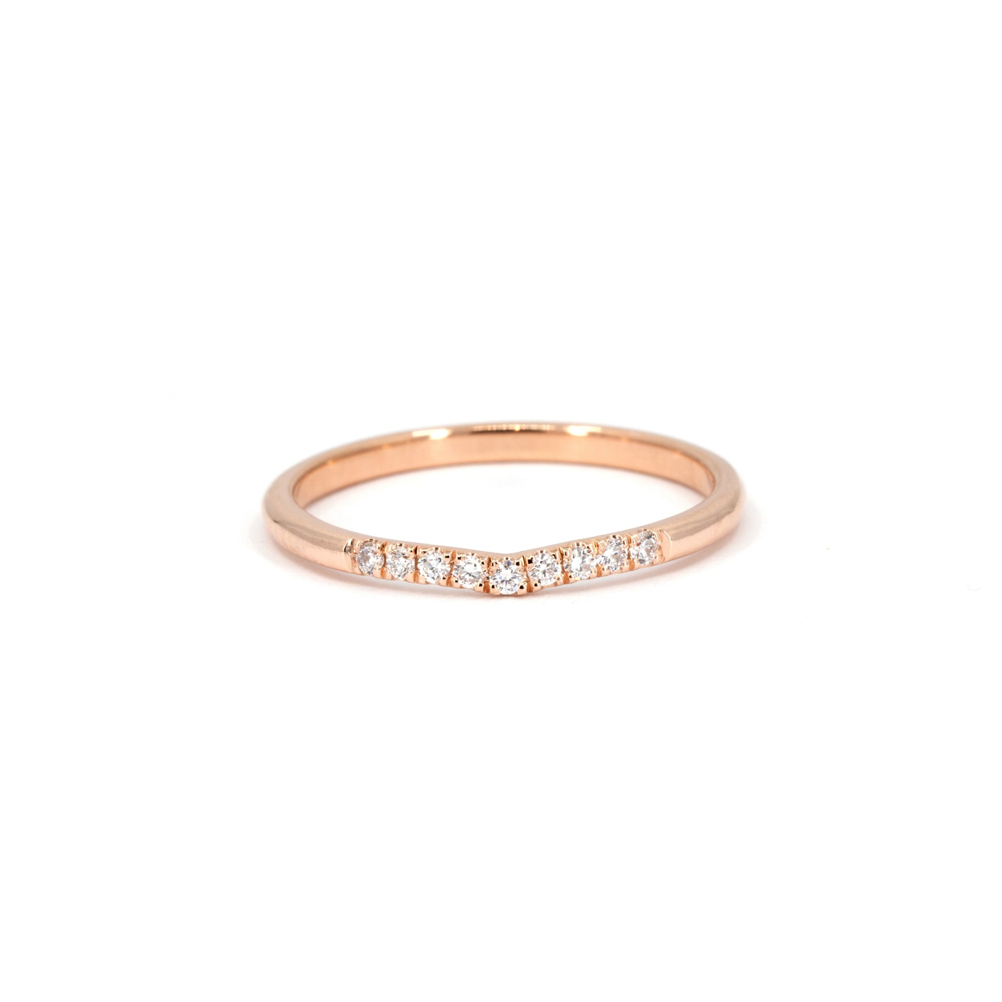 Luna Band by Bena Jewelry – A curved rose gold diamond ring on a white background. Designed by an independent jewelry designer in Montreal.