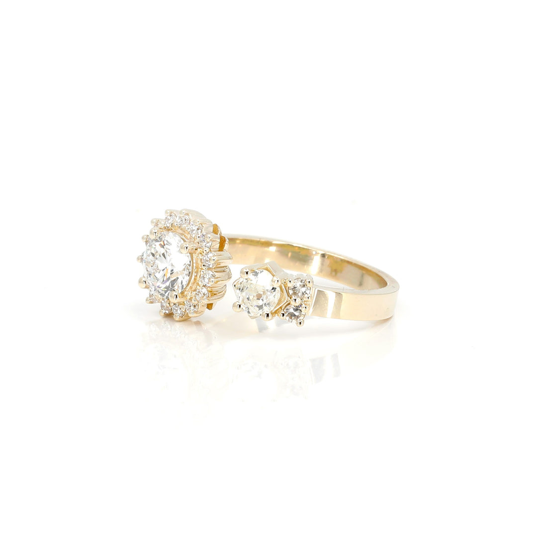 round shape and lab grown diamond halo custom made engagement ring by bena jewelry montreal on white background