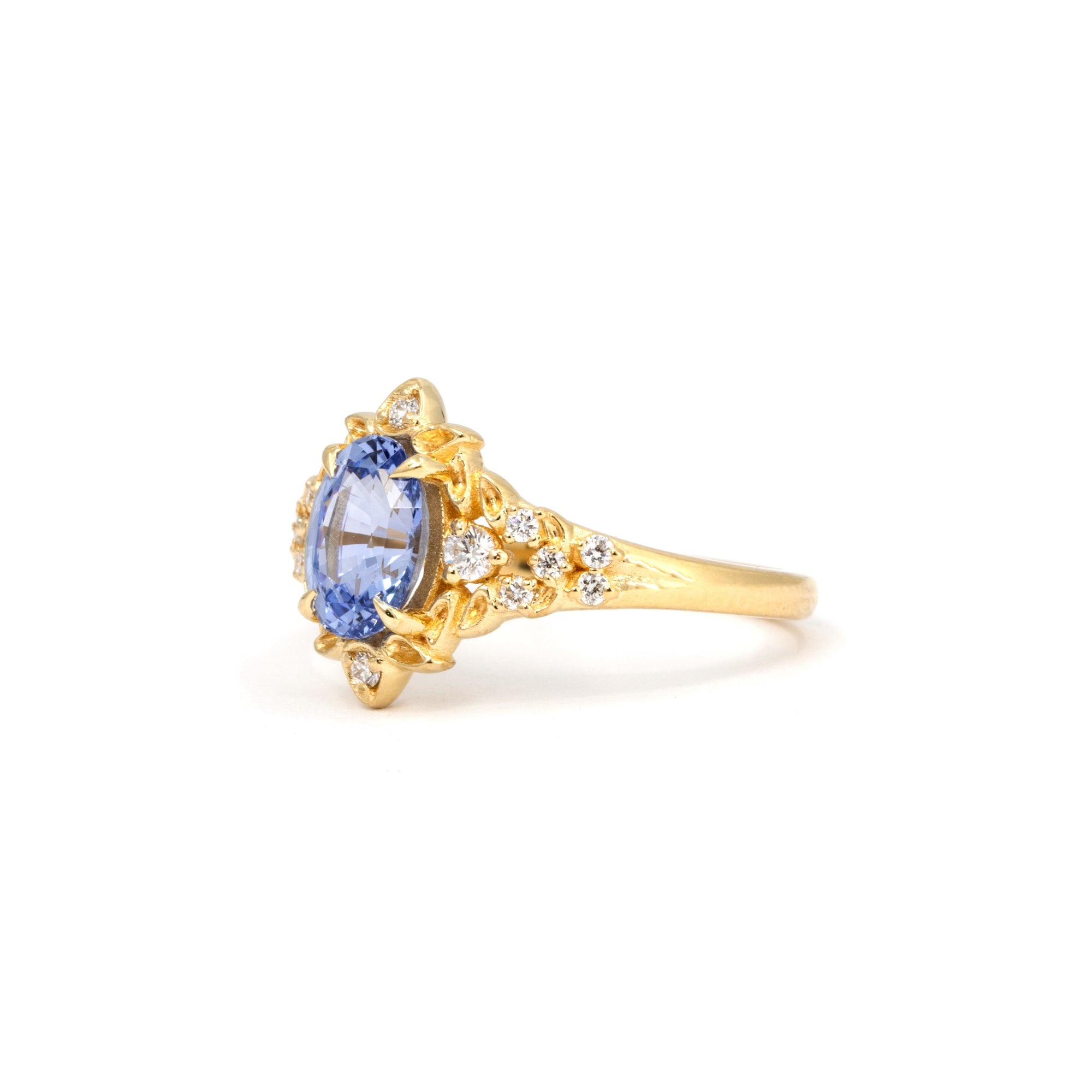 Side view of floral sapphire ring – A refined engagement ring with an elegant, nature-inspired aesthetic, handcrafted in yellow gold.