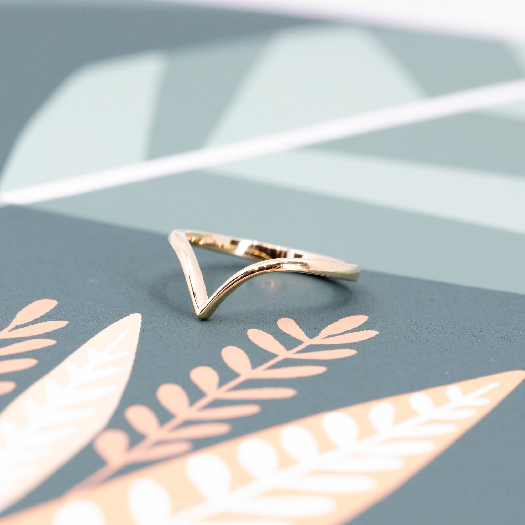 Minimalist wedding ring in a modern V-shape, worn on the hand – A handcrafted bridal piece by Bena Jewelry, made in Montreal.