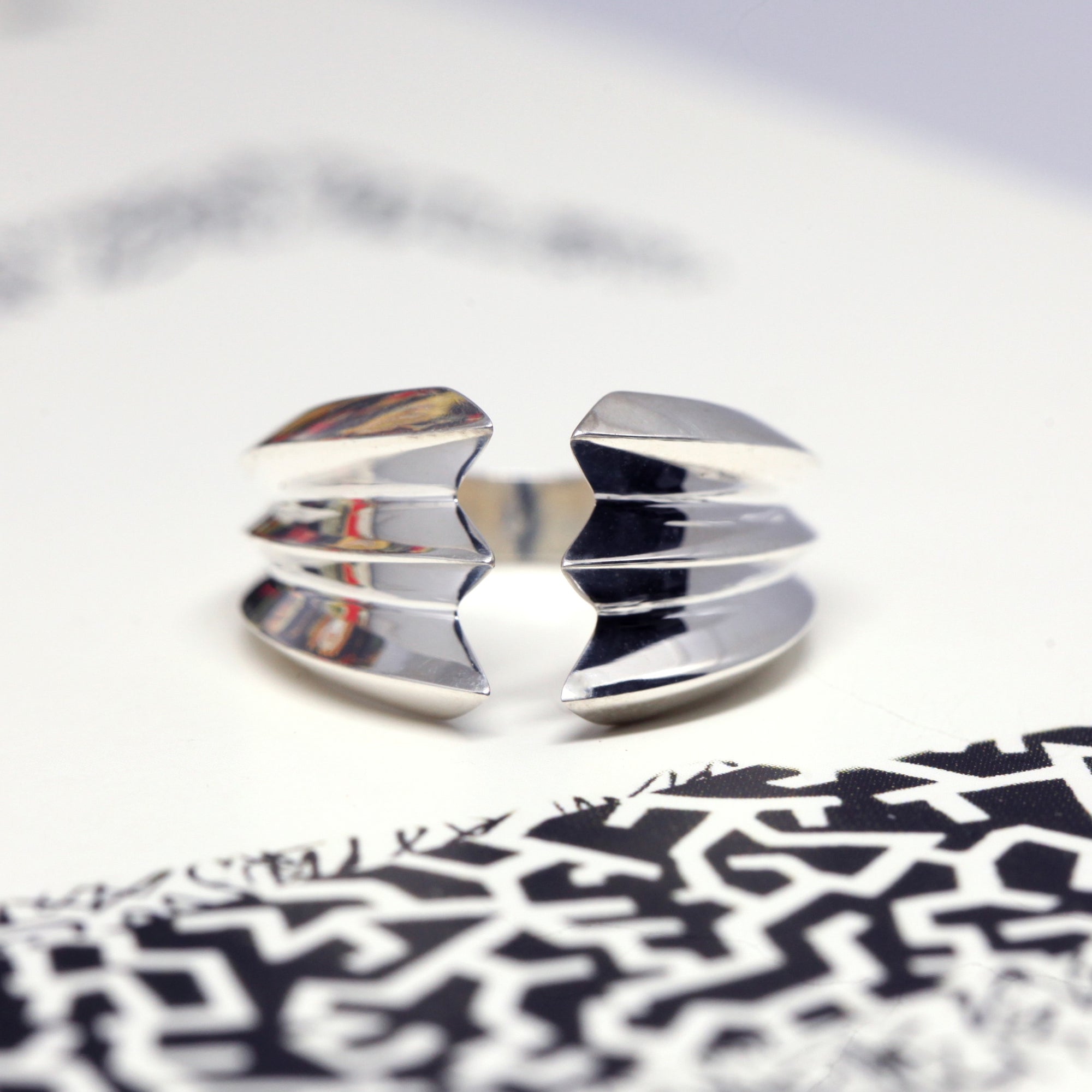 Crush Ring in White Gold on white background – Bold unisex gold ring with a striking layered design, crafted in solid white gold by Bena Jewelry in Montreal.