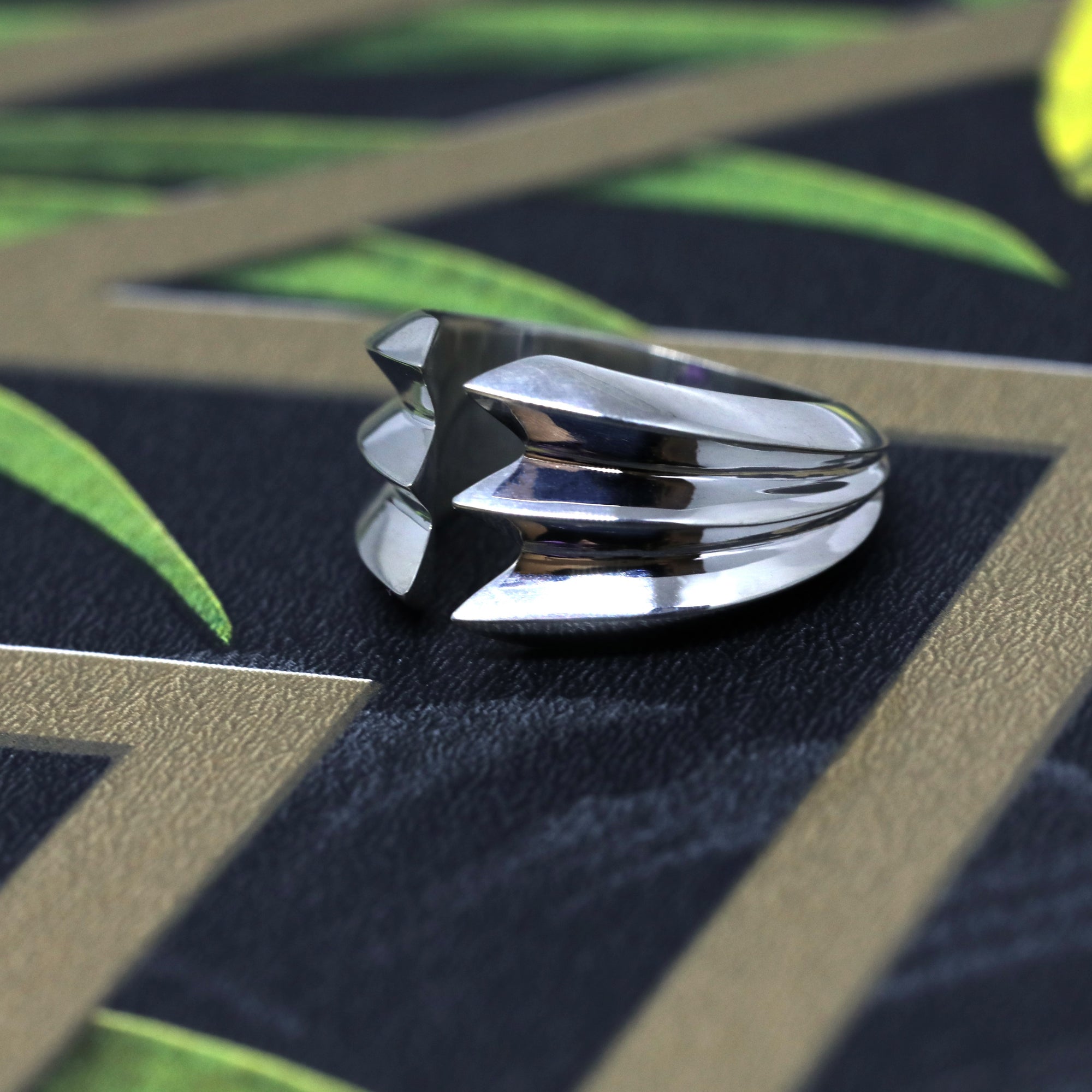 Close-up of Crush Ring in White Gold – A statement designer ring with sculptural, stacked edges for a strong, modern aesthetic.