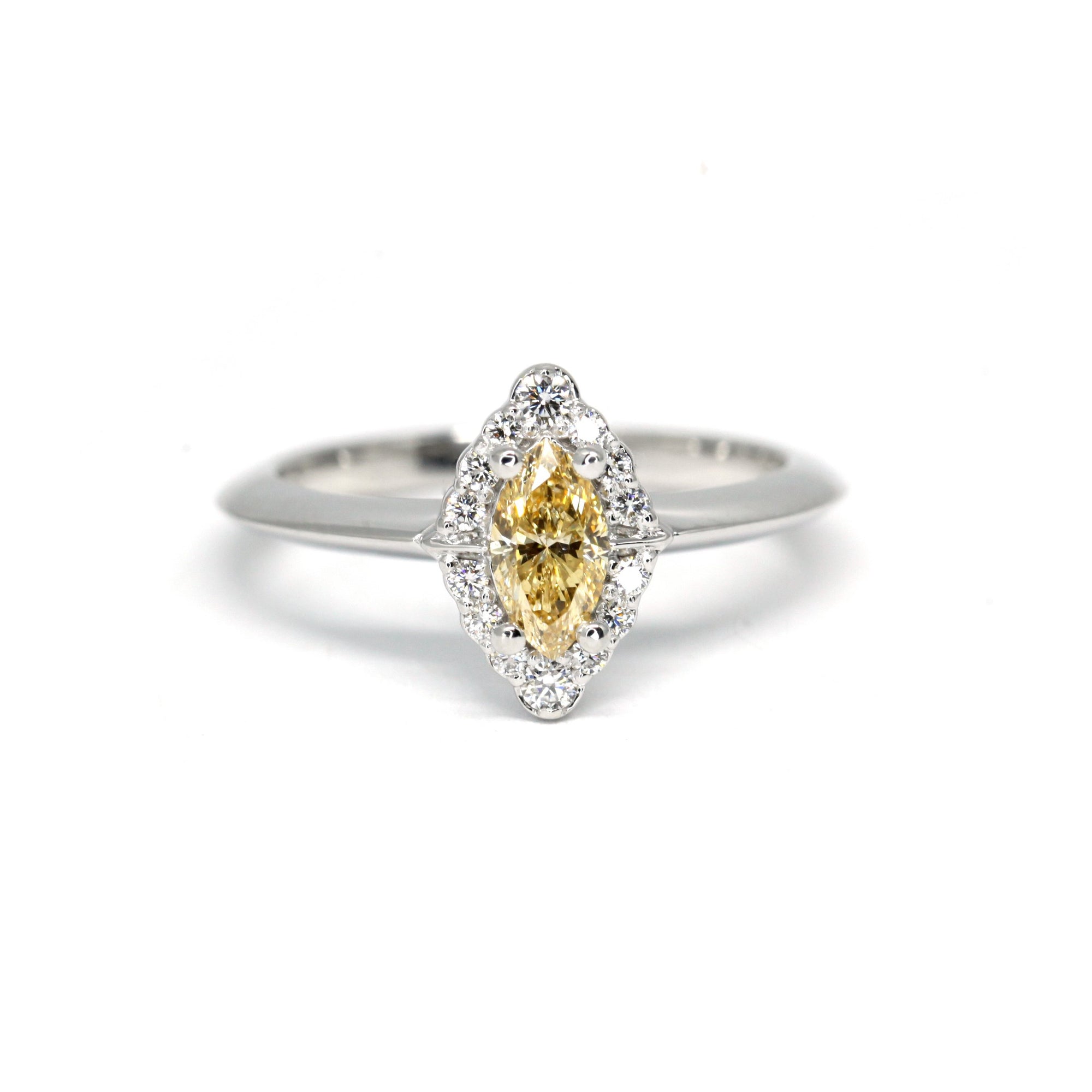 This marquise shape yellow diamond white gold engagement ring is custom made in Montreal, by Bena Jewelry, canadian bridal jeweler.