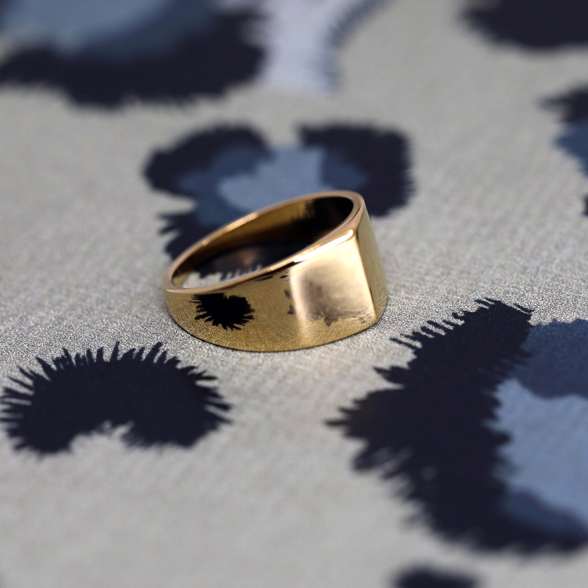 Angled shot of Lump Ring in Yellow Gold – A contemporary statement ring with a minimalist yet bold design.