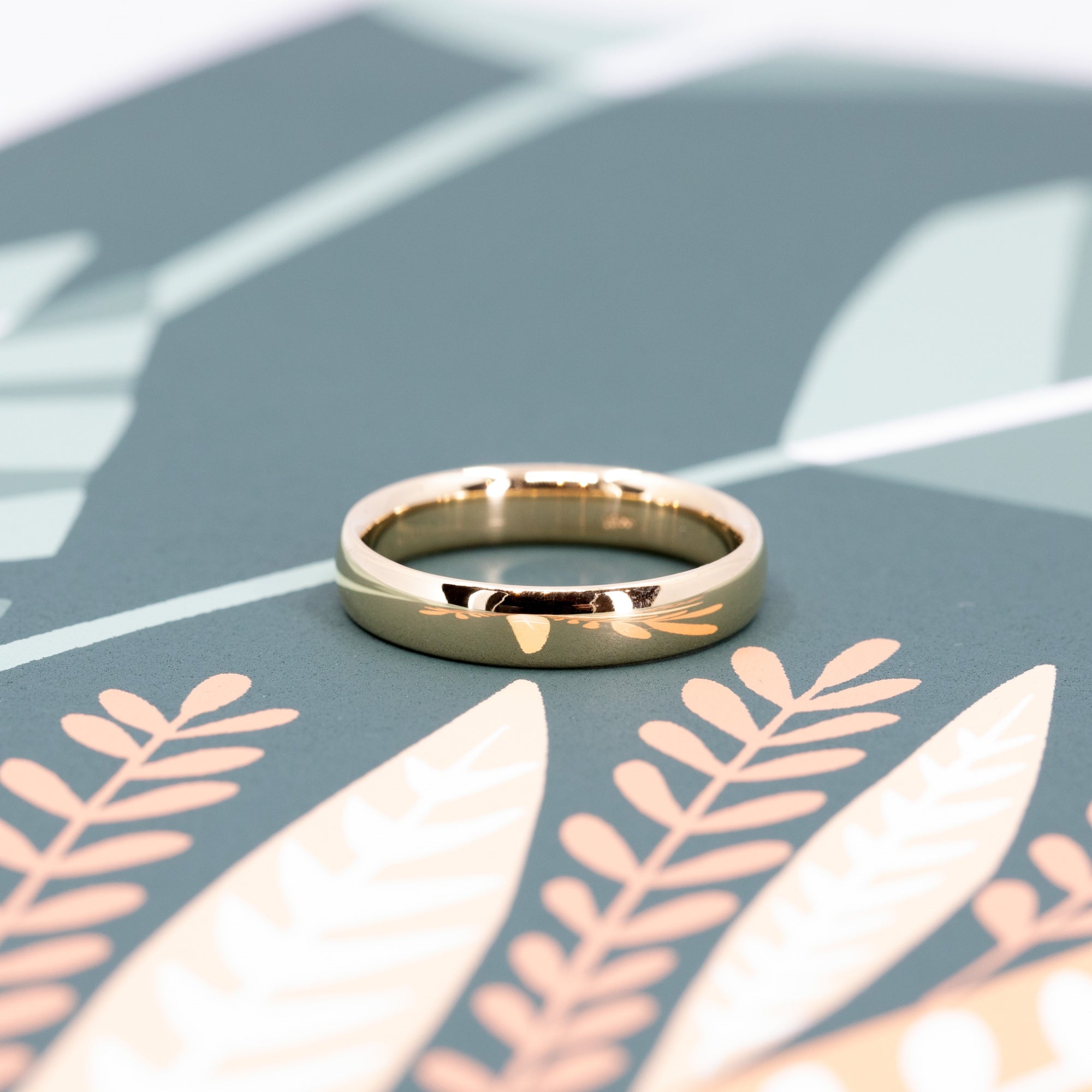 Front view of a yellow gold men wedding ring, classic design with a dome for an ellegant look. Custom made bridal jewellery in Montreal, by Bena Jewelry designer.