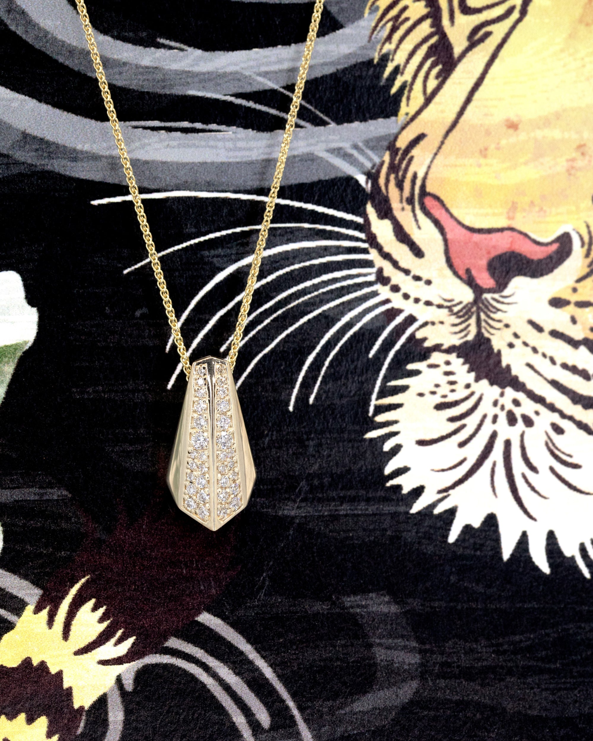 Artistic view of the Ballast pendant by Bena Jewelry, featuring intricate architectural design and diamond pavé. A modern, edgy statement piece crafted for those who embrace audacious jewelry.