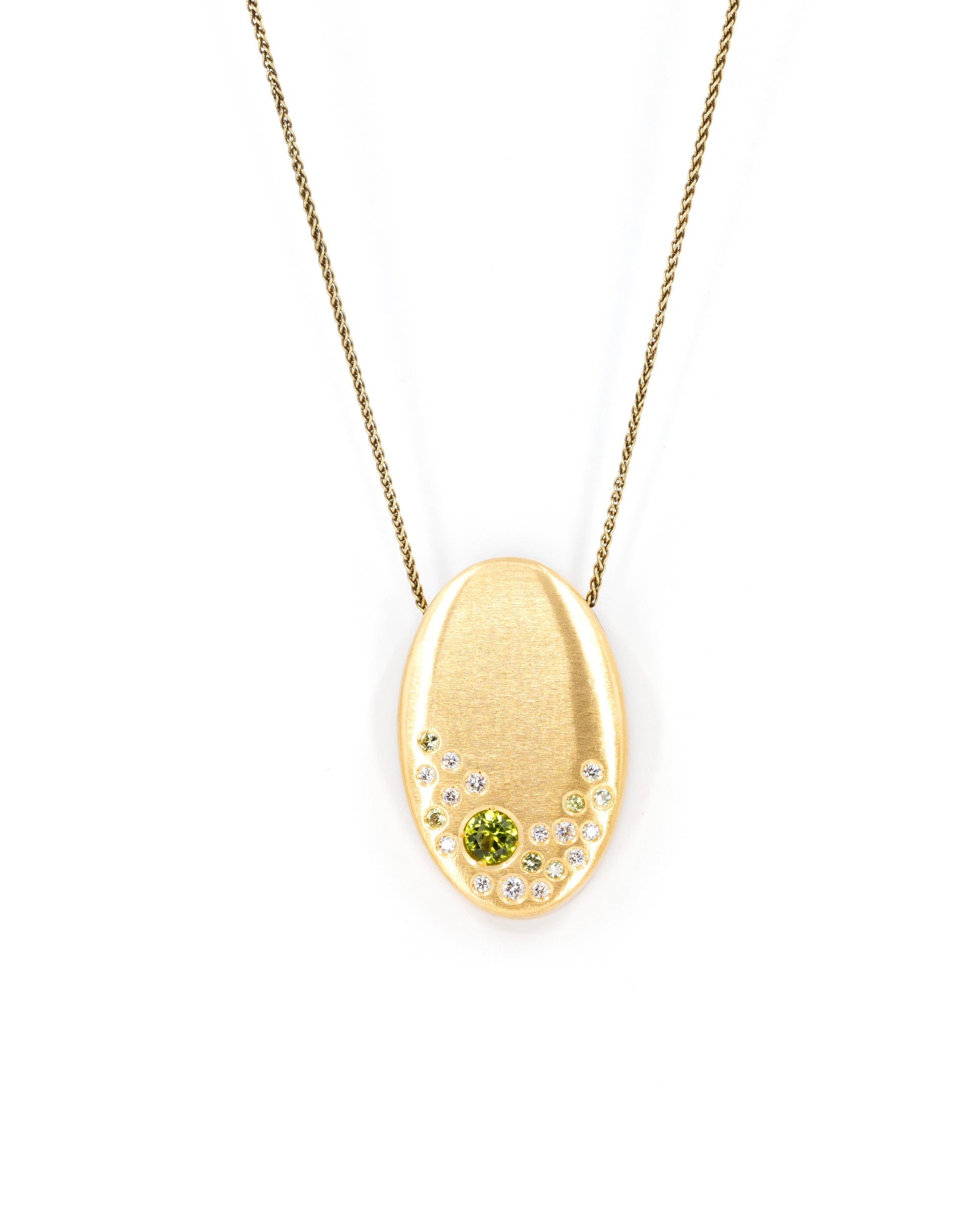 Side view of the 22K Gold Oval Pendant, crafted in Montreal – A modern fine jewelry piece with an organic, artistic aesthetic, handmade in Canada.