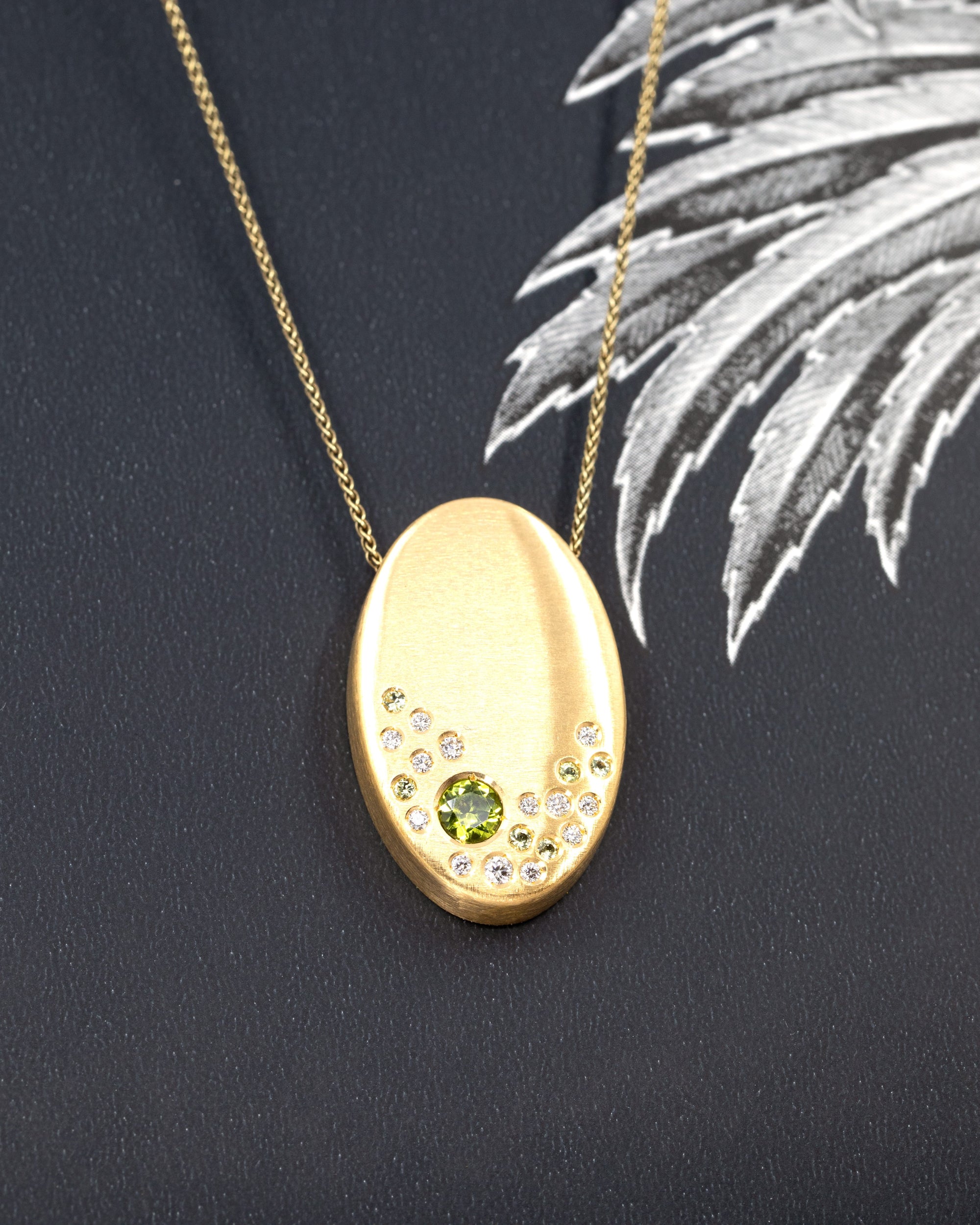 Side angle of the pendant worn, showing the interplay of gold and gemstones – A striking statement necklace, handcrafted in Montreal.