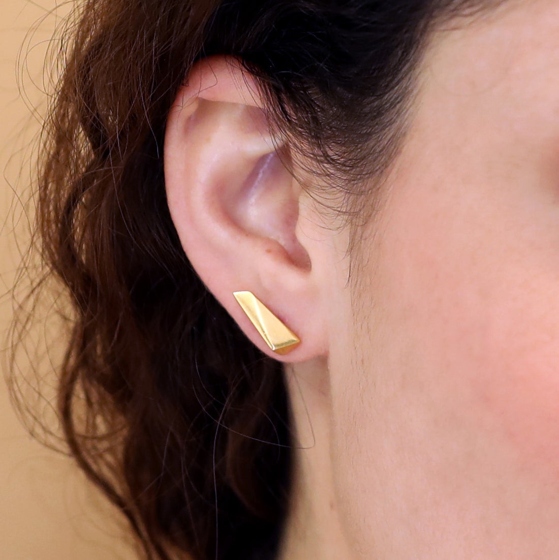 Girl wearing elegant small stud gold plated earrings Bena Jewelry Vermeil Gold Plated Silver Pike Edgy Collection Montreal Jewelry Designer Made in Canada