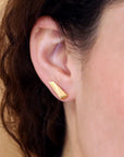 Girl wearing elegant small stud gold plated earrings Bena Jewelry Vermeil Gold Plated Silver Pike Edgy Collection Montreal Jewelry Designer Made in Canada
