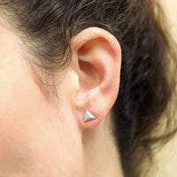 Girl wearing pyramidal white gold and diamond stud earrings Bena Jewelry designer from Fancy Edgy Collection made in Montreal Canada jewelry gallery montreal little italy jeweler diamond stud earings edgy modern jewelry
