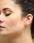 Girl wearing white gold and diamond earrings Bena Jewelry