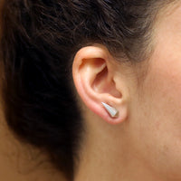 Woman wearing elegant small stud sterling silver stud jewelry