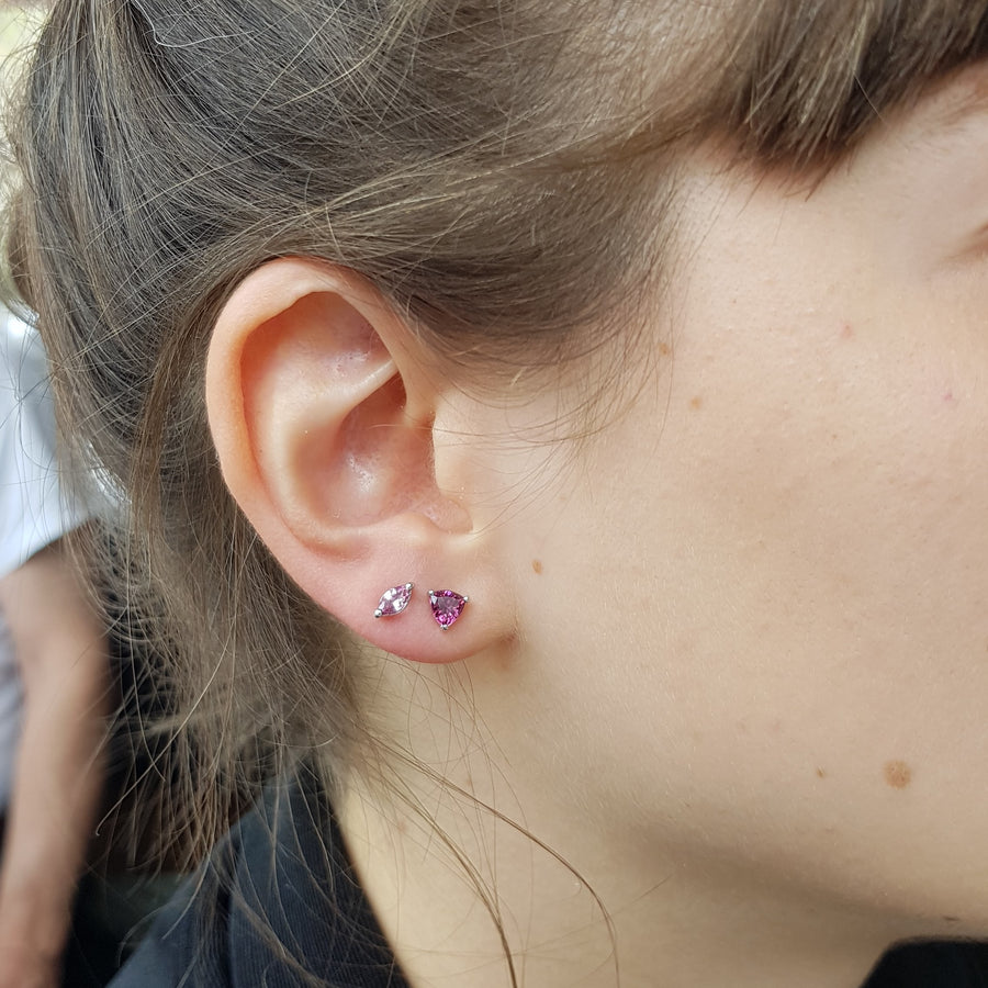 Girl wearing pink trillion garnet stud earrings bena jewelry custom made jewelry montreal garnet bridal jewelry minimalist pink trillion gemstone jewelry