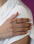 girl wearing bena jewelry emerald cut dark brown diamond ruby mardi montreal engagement ring