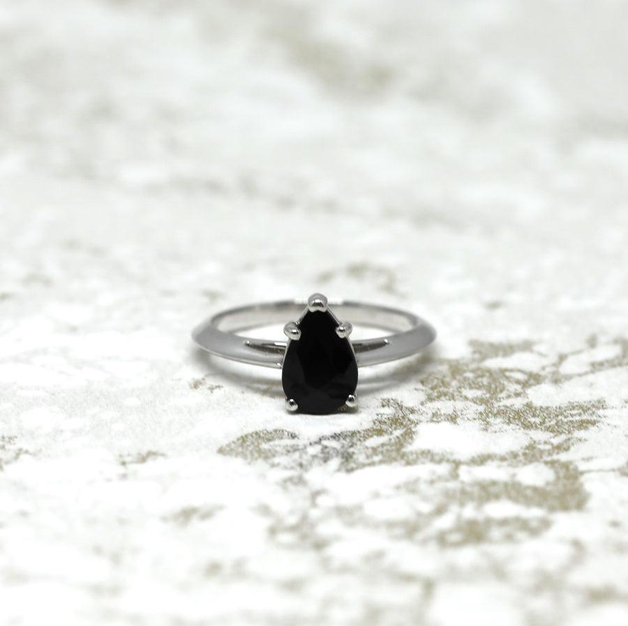 Front view of black pear shape gemstone gold engagement ring natural black spinel gemstone fine jewelry montreal little italy bena jewelry jeweler custom made color gemstone engagement ring montreal made in canada fine jewelry designer