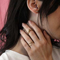 girl wearing a vermeil gold plated simple band minimalist ring yellow gold silver plated jewelry bena jewelry montreal
