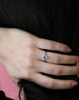 girl wearing bena jewelry color gemstone bridal engagement ring purple pear shape sapphire diamond ring handmade in litte italy montreal fine jewelry designer