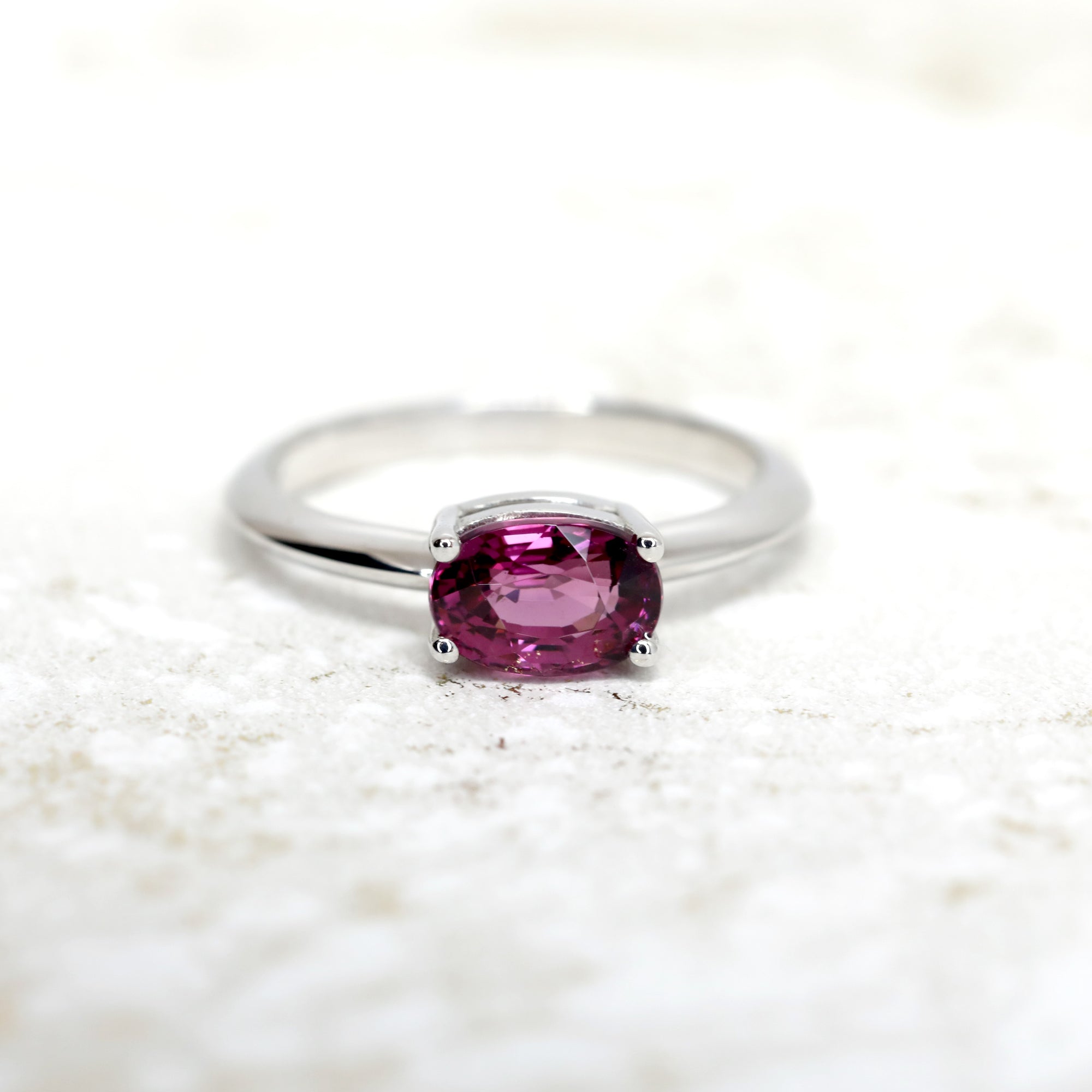 front view of garnet engagement ring bena jewelry beautiful red garnet rhodolite natural gemstone custom made color gemstone jewelry handmade in canada oval red gemstone gold ring bridal jewelry