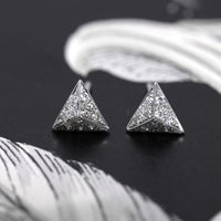 Front view of the pyramidal white gold and diamond stud earrings from Fancy Edgy Collection Bena Jewelry Designer Montreal Made in Canada jewelry gallery montreal little italy jeweler custom made edgy cocktail jewelry diamond small earrings studs white gold earrings edgy minimalist pyramidal shape studs