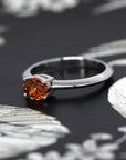 side view of minimalist garnet gold ring spessartite garnet engagement bena jewelry custom jewelry montreal color gemstone garnet ring sapphire engagement ring