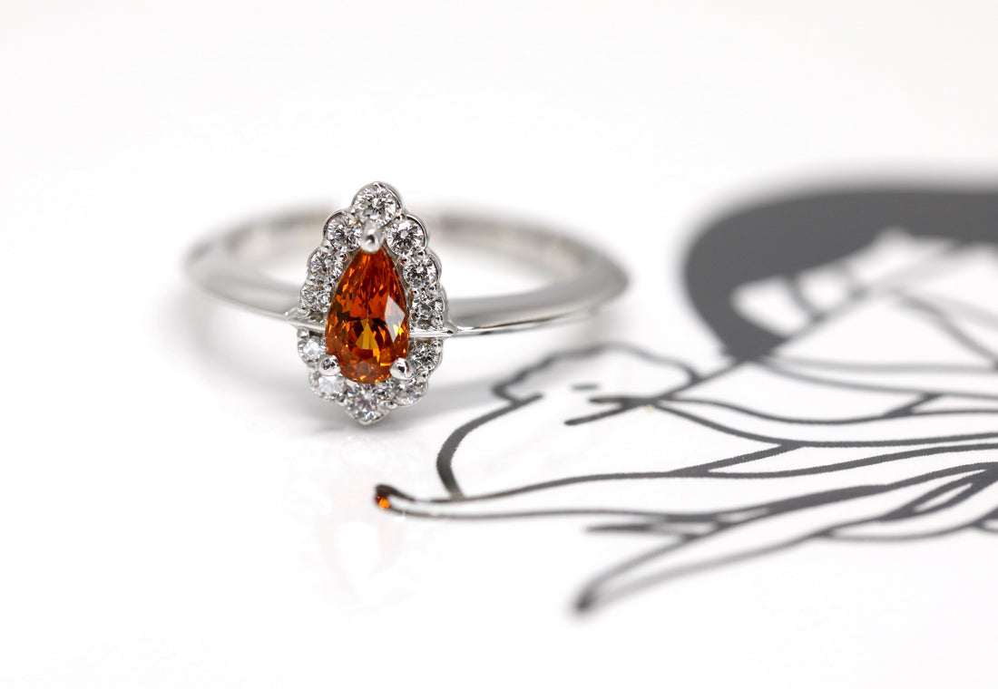 pear shape spessartite garnet diamond halo bena jewlery montreal handmade jewelry montreal custom color gemstone bridal ring vivid orange diamond ring