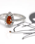 pear shape spessartite garnet diamond halo bena jewlery montreal handmade jewelry montreal custom color gemstone bridal ring vivid orange diamond ring