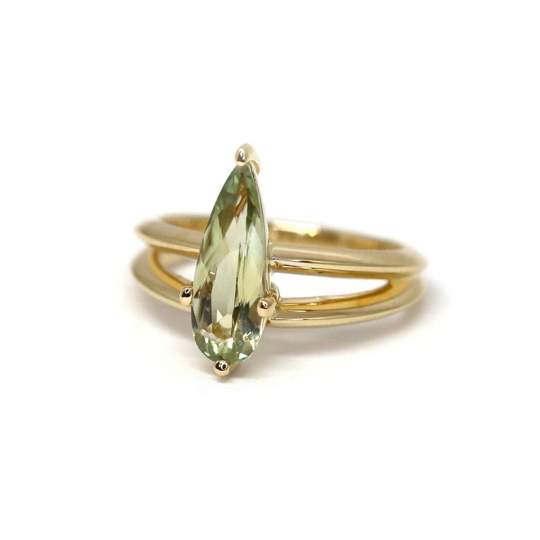 front view of pear shape diaspore ring bena jewelry designer yellow gold double band engagement ring modern long pear shape green diaspore ring