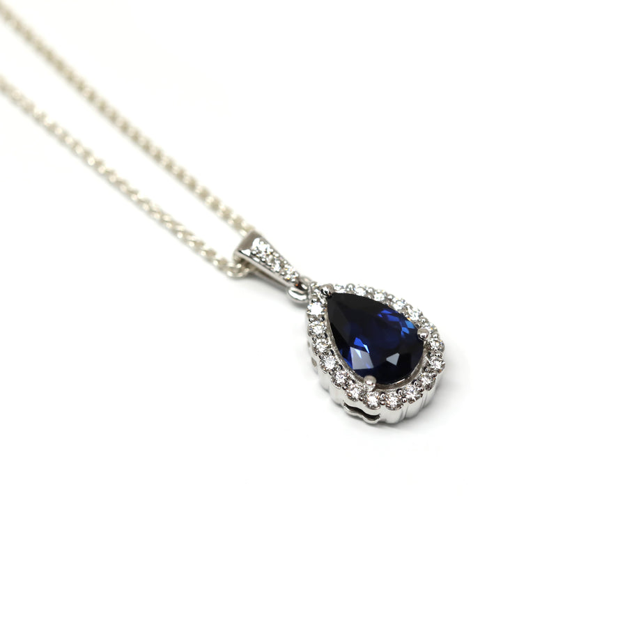 side view of pear shape sapphire diamond pendant made in montreal bena jewelry designer custom fine jewelry color gemstone fine jewelry montreal