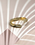 men wedding band yellow gold fine bena jewelry design in montreal edgy rings on pink and white background