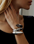 Woman wearing statement bracelet big silver bracelet 925 sterling silver jewelry