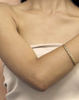 girl wearing gold edgy bangle bracelet bena jewelry designer